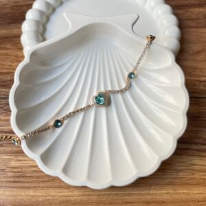 P18149 PULSERA DE PIEDRAS CON CORAZON CELESTE 18K 22CM