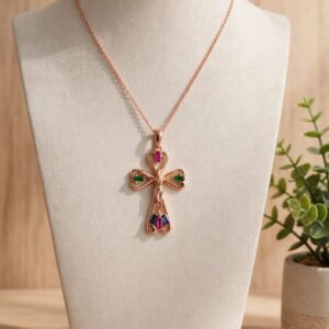 D18004 CRUZ DE CORAZON CON PIEDRA DE COLORES