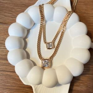 C18160 CADENA DOBLE CON 2 DIJES DE PIEDRA 18K 50CM