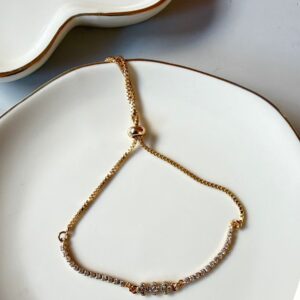 P18431 PULSERA CON PIEDRAS Y BRILLOS A LOS LADOS 26CM 18K